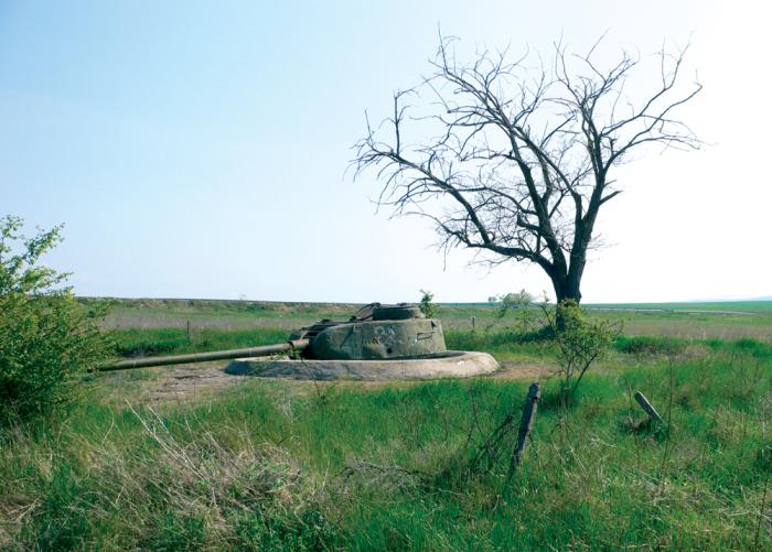 Yambol enthusiast Konstantin Zaykov inspects a relatively well-preserved German Panzer near the village of Fakiya