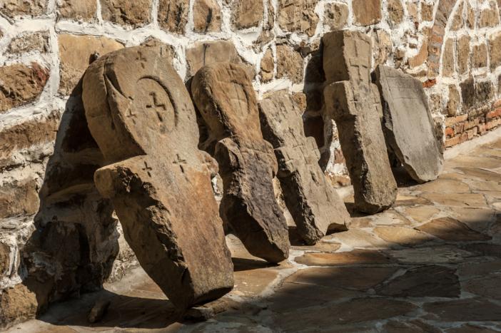 Old tombstones lined by St Nicholas Church