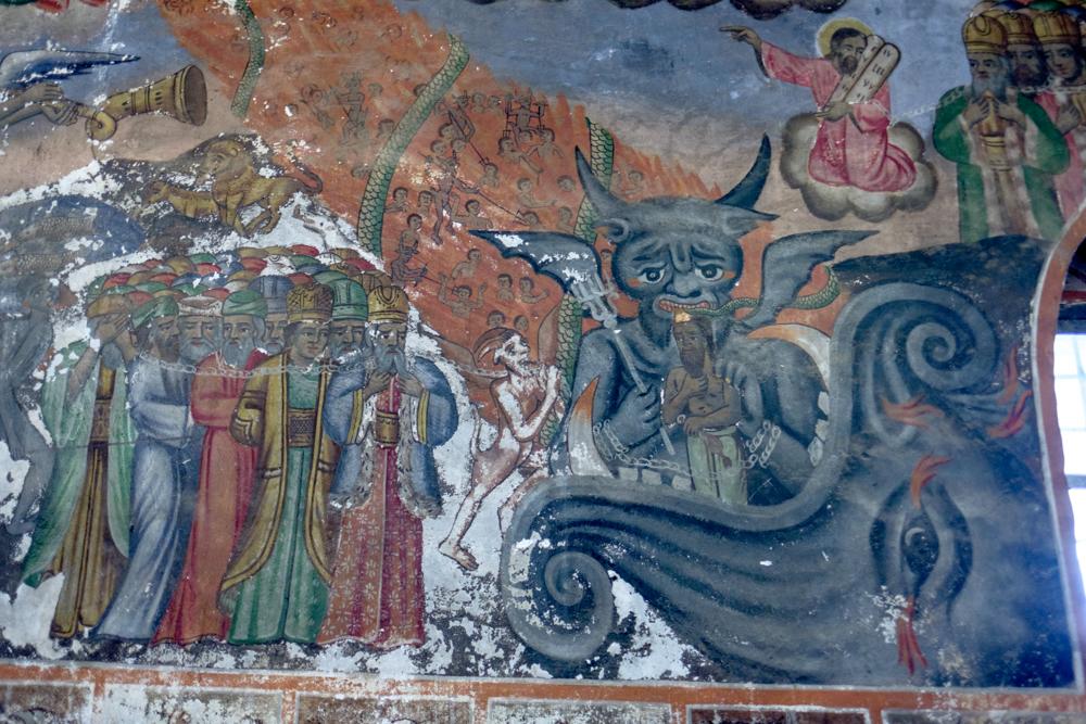 An Orthodox Satan is about to devour a unrighteous man in the village of Teshovo, western Bulgaria